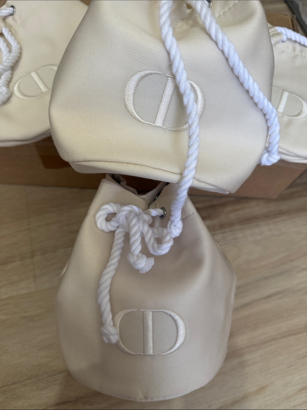 Cream Drawstring Bucket Bag with Embroidered Logo